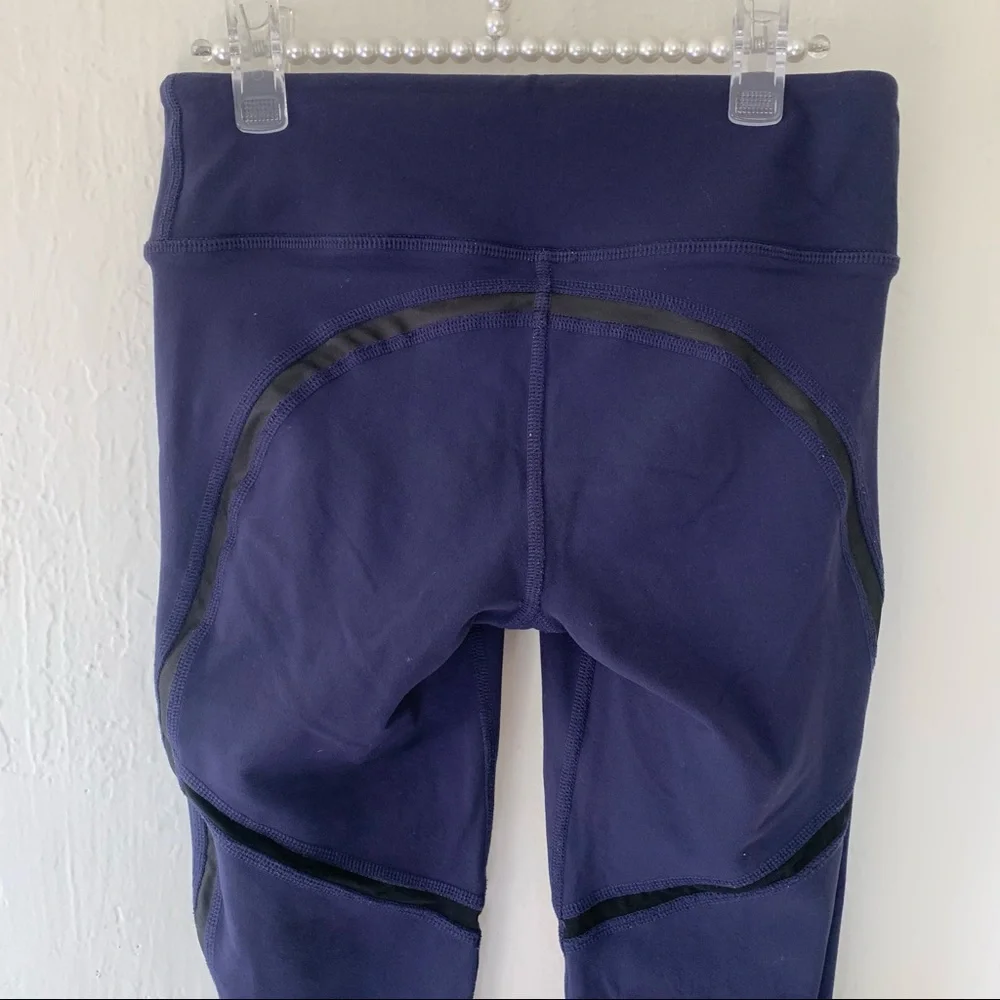 ALO Yoga Continuity Capri Legging In Rich Navy